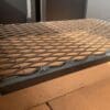 A charcoal grate made for a Santa Maria grill firebox.