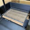 Charcoal screen for airflow in a wood grill.