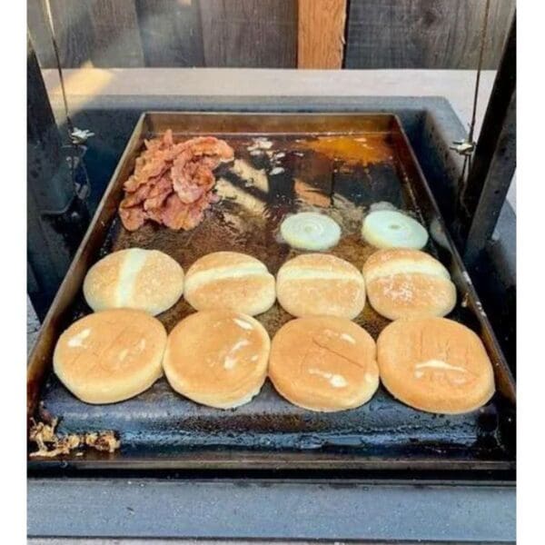Flat plate griddle to cook on a wood grill