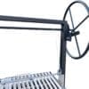 Large wheel for lifting a grate on a Santa Maria grill.