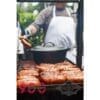 Cooking sausage on a Santa Maria grill with a Dutch oven