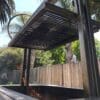Built in grill unit with grate hoist system