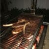 Built in Gaucho grill for cooking tomahawk steaks.