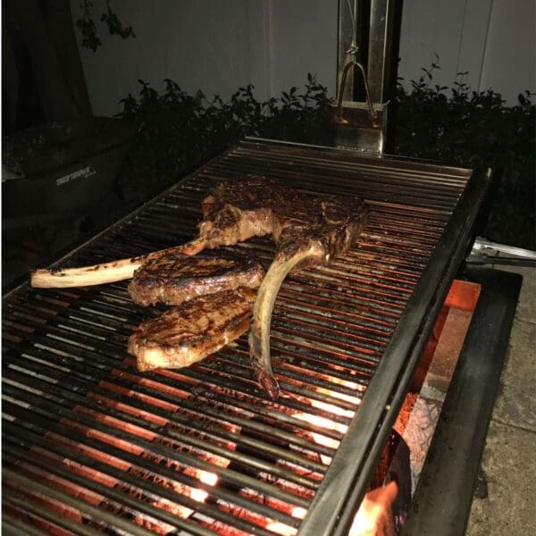Built in Gaucho grill for cooking tomahawk steaks.