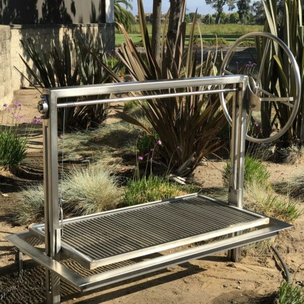Built in parrilla style stainless grill with hand crank and hoist system
