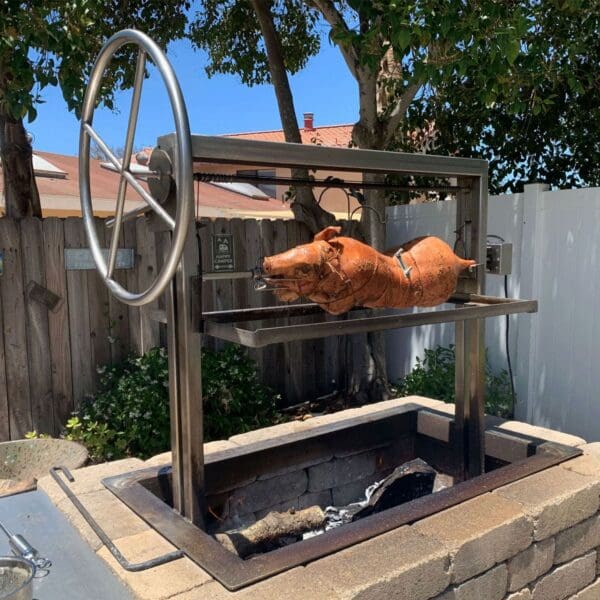 Whole hog roast on a built in Gaucho grill spit