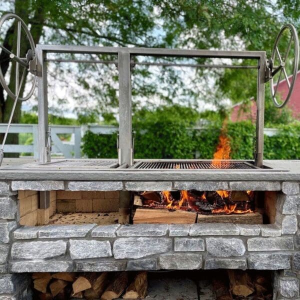 Built in Gaucho Argentina grill with two independent cooking grates and large wheel cranks