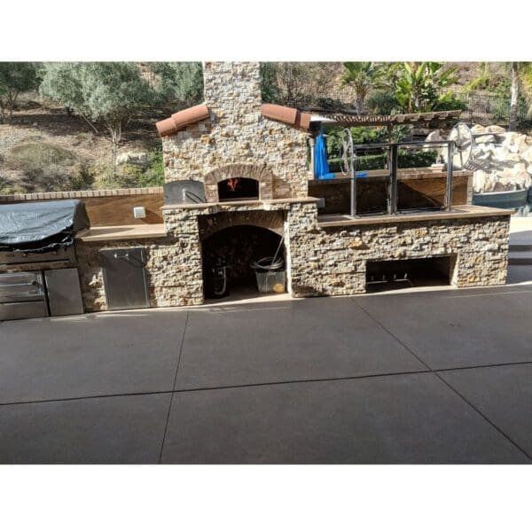 Built in Gaucho grill installed into an outdoor kitchen island