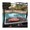 Residential grill for wood or charcoal