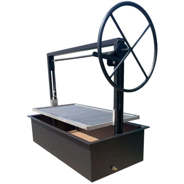 Santa Maria style drop in firebox grill with large hand wheel.