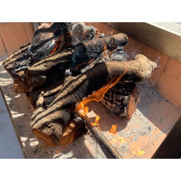 Burner tube for propane in a charcoal grill.