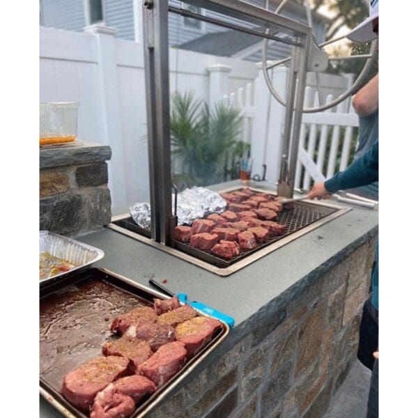 Stainless steel grill insert for an outdoor kitchen.